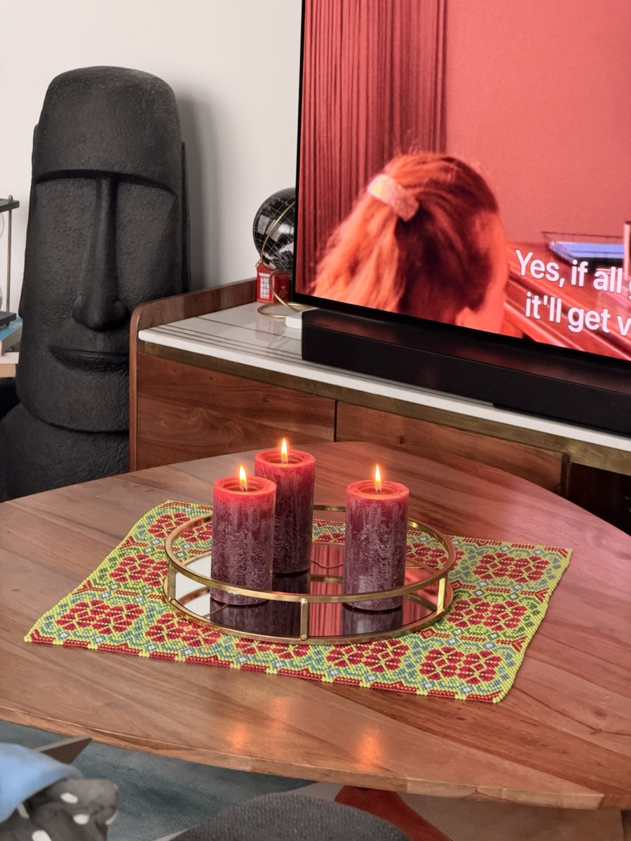 Green square with red candles on the dining table