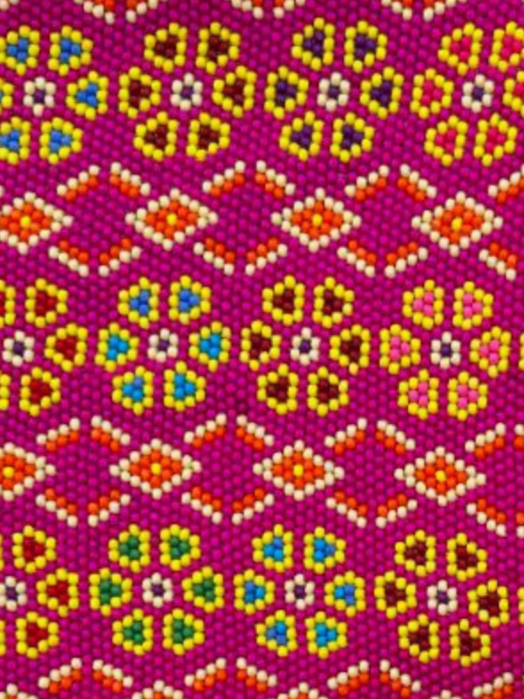 Close-up of Magenta flowers: yellow bead flowers on magenta
